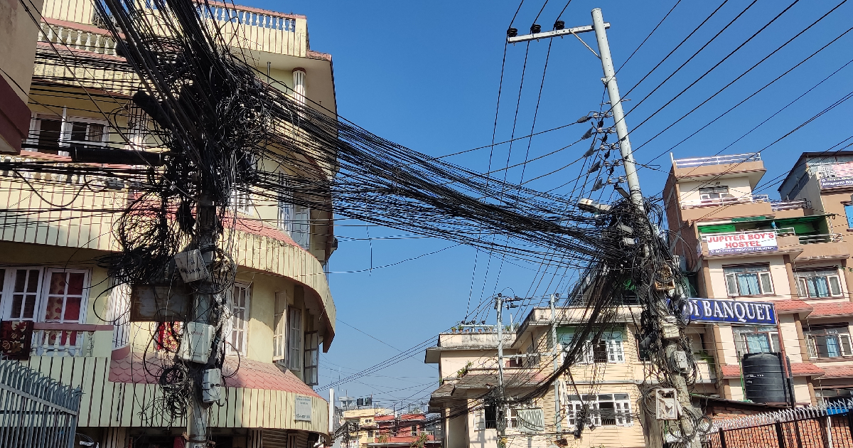 Rampantly installed cable being managed in Biratnagar